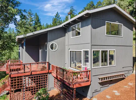 a view of a chairs and table in the patio