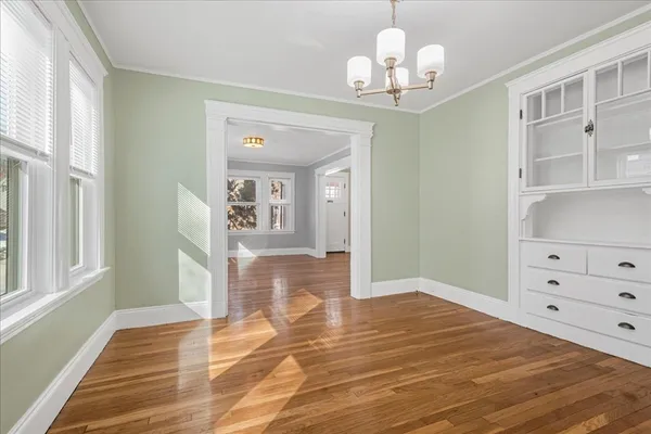 a view of a livingroom with wooden floor
