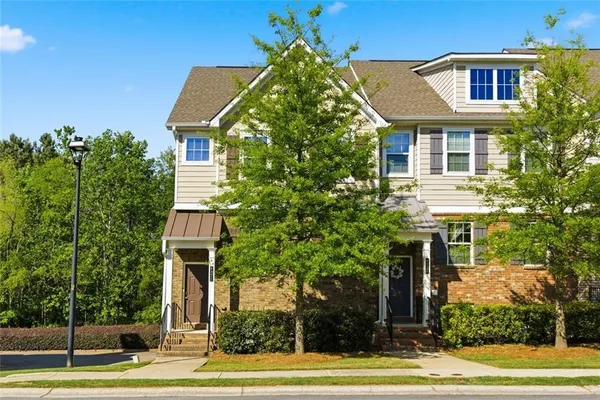a front view of a house with a yard