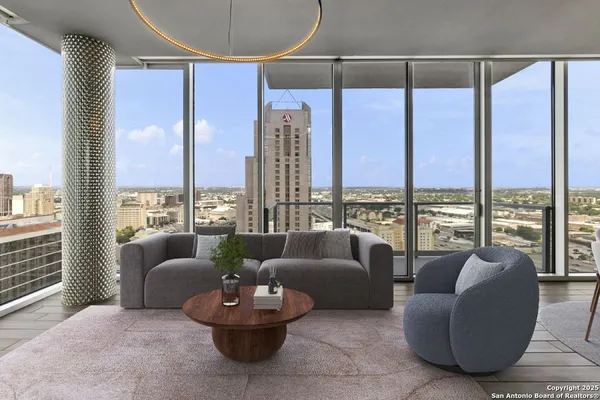 a living room with furniture and a large window