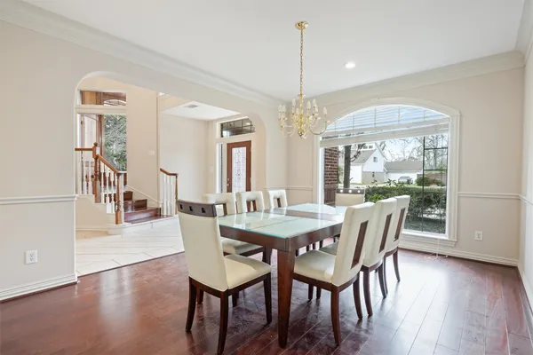 a view of a dining room with furniture window and wooden floor