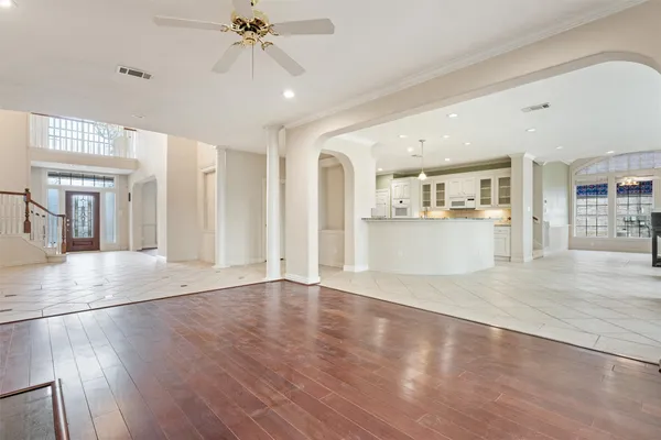 a view of a kitchen with wooden floor and a kitchen