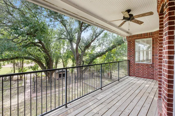 a view of balcony with wooden floor