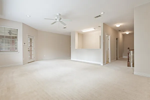 an empty room with windows and closet