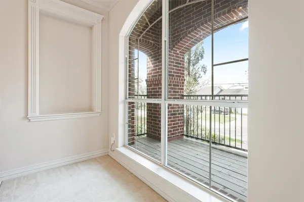 a view of a balcony with wooden floor