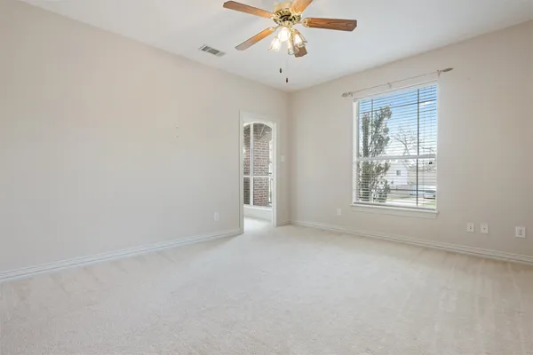a view of an empty room with a window