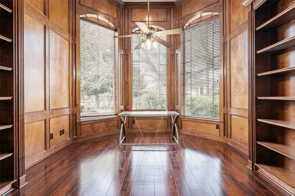 a view of workspace with wooden floor and furniture
