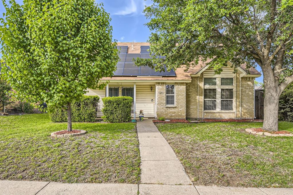 front view of a house with a yard