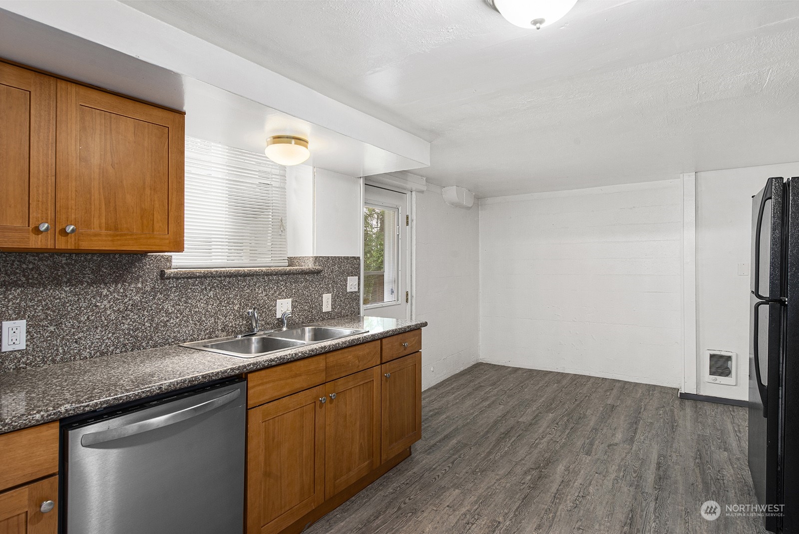 260 Taylor Avenue Northwest Renton, WA 98057 - Photo 17 of 26 a kitchen with a sink cabinets stainless steel appliances and a counter space