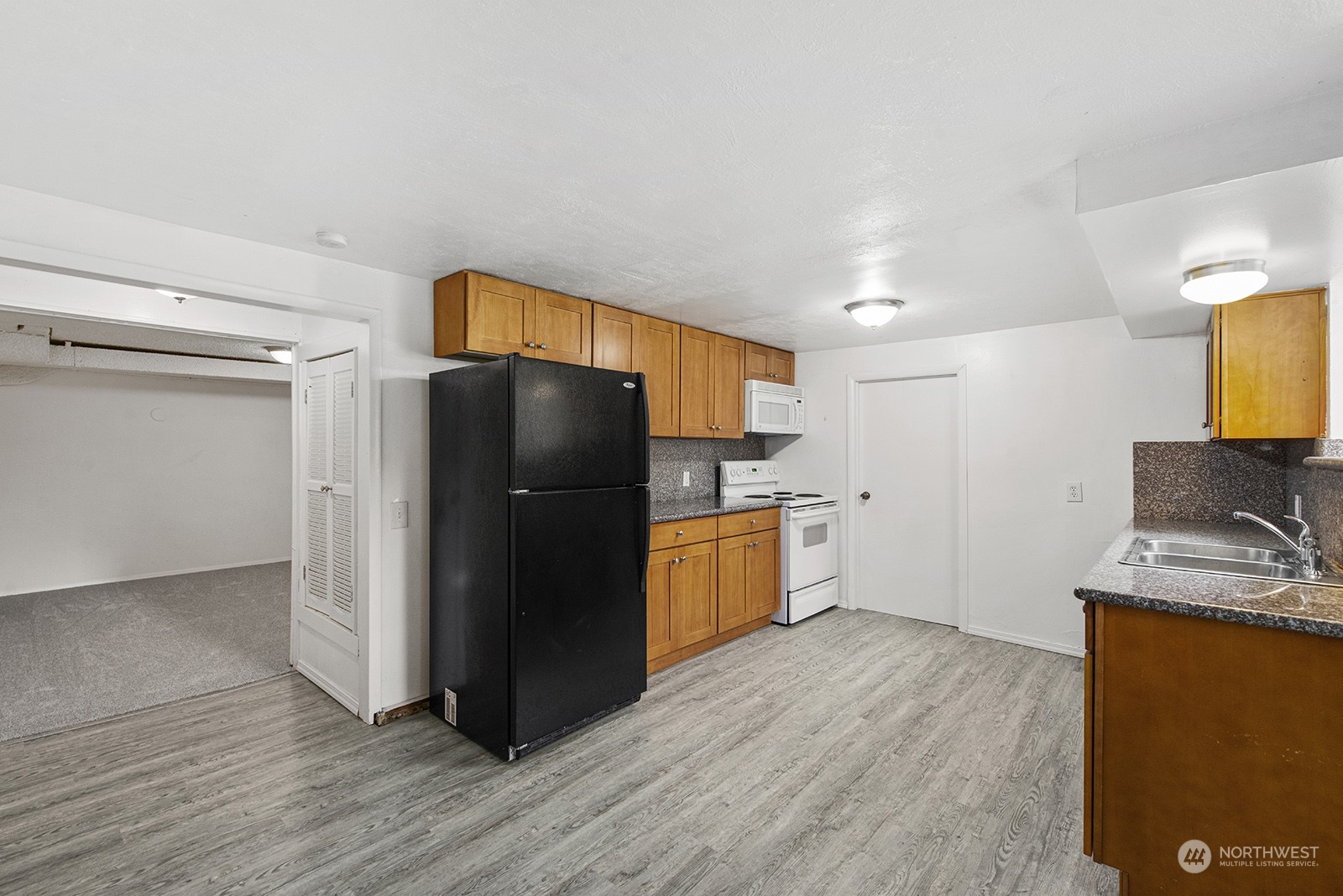 260 Taylor Avenue Northwest Renton, WA 98057 - Photo 18 of 26 a kitchen with stainless steel appliances a refrigerator and a stove