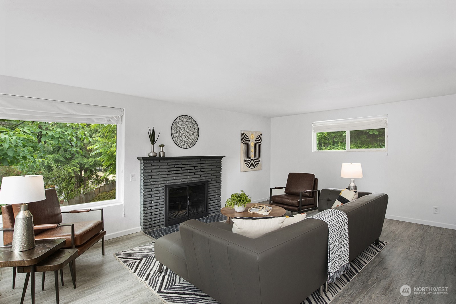 260 Taylor Avenue Northwest Renton, WA 98057 - Photo 5 of 26 a living room with furniture a window and a fireplace
