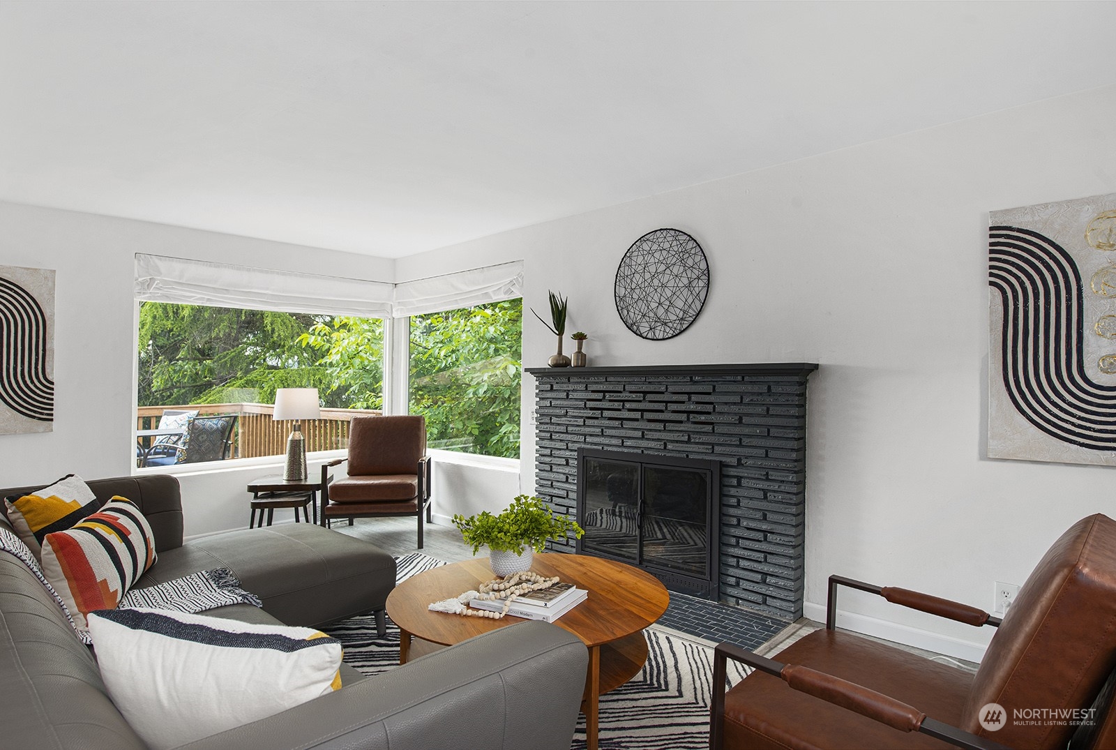 260 Taylor Avenue Northwest Renton, WA 98057 - Photo 6 of 26 a living room with furniture a fireplace and a large window
