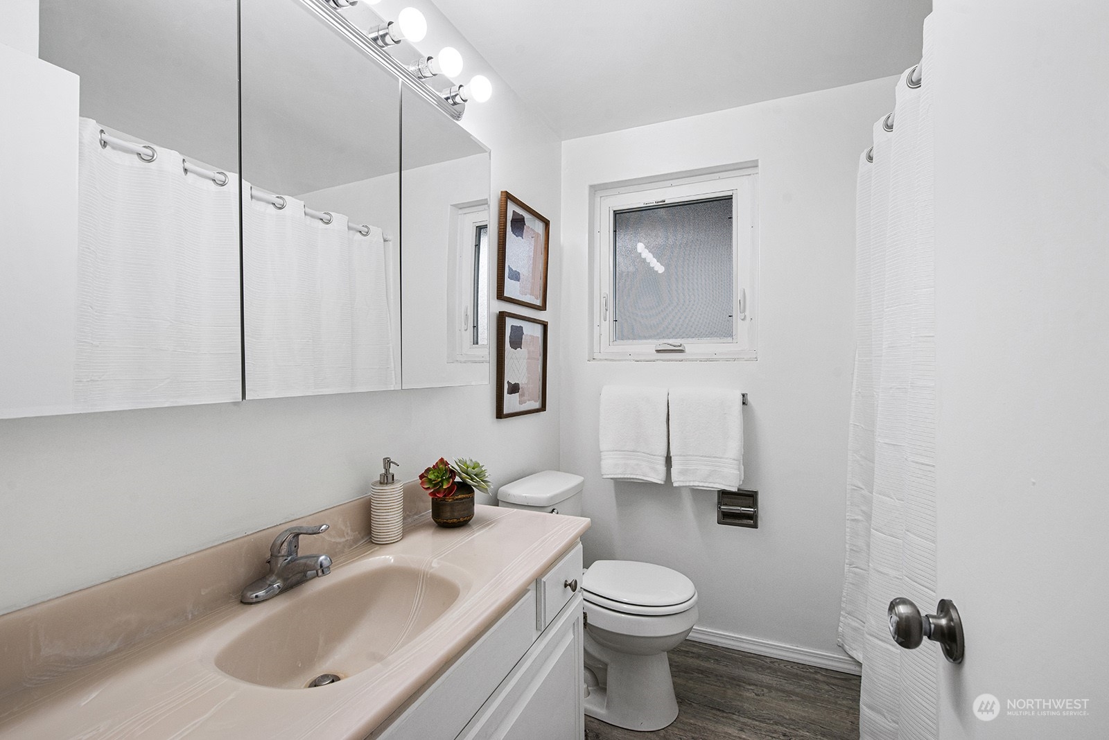 260 Taylor Avenue Northwest Renton, WA 98057 - Photo 10 of 26 a bathroom with a sink toilet and vanity