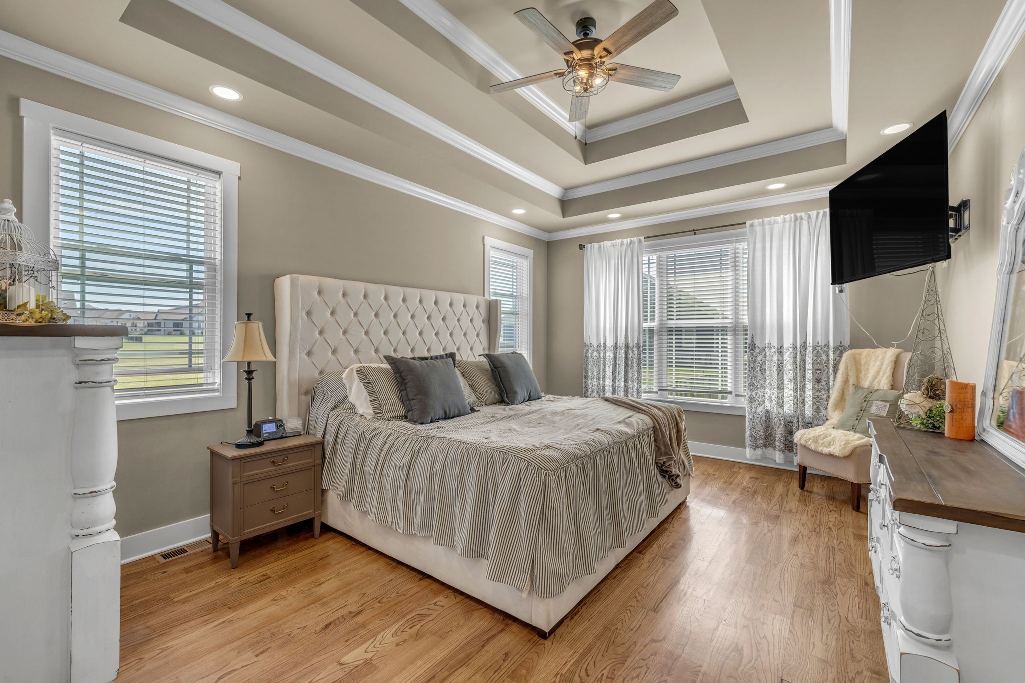 214 River Watch Way Winchester, TN 37398 - Photo 19 of 82 a bedroom with a bed window and a flat screen tv