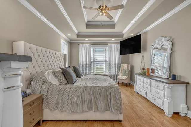 a view of a workspace with furniture and wooden floor