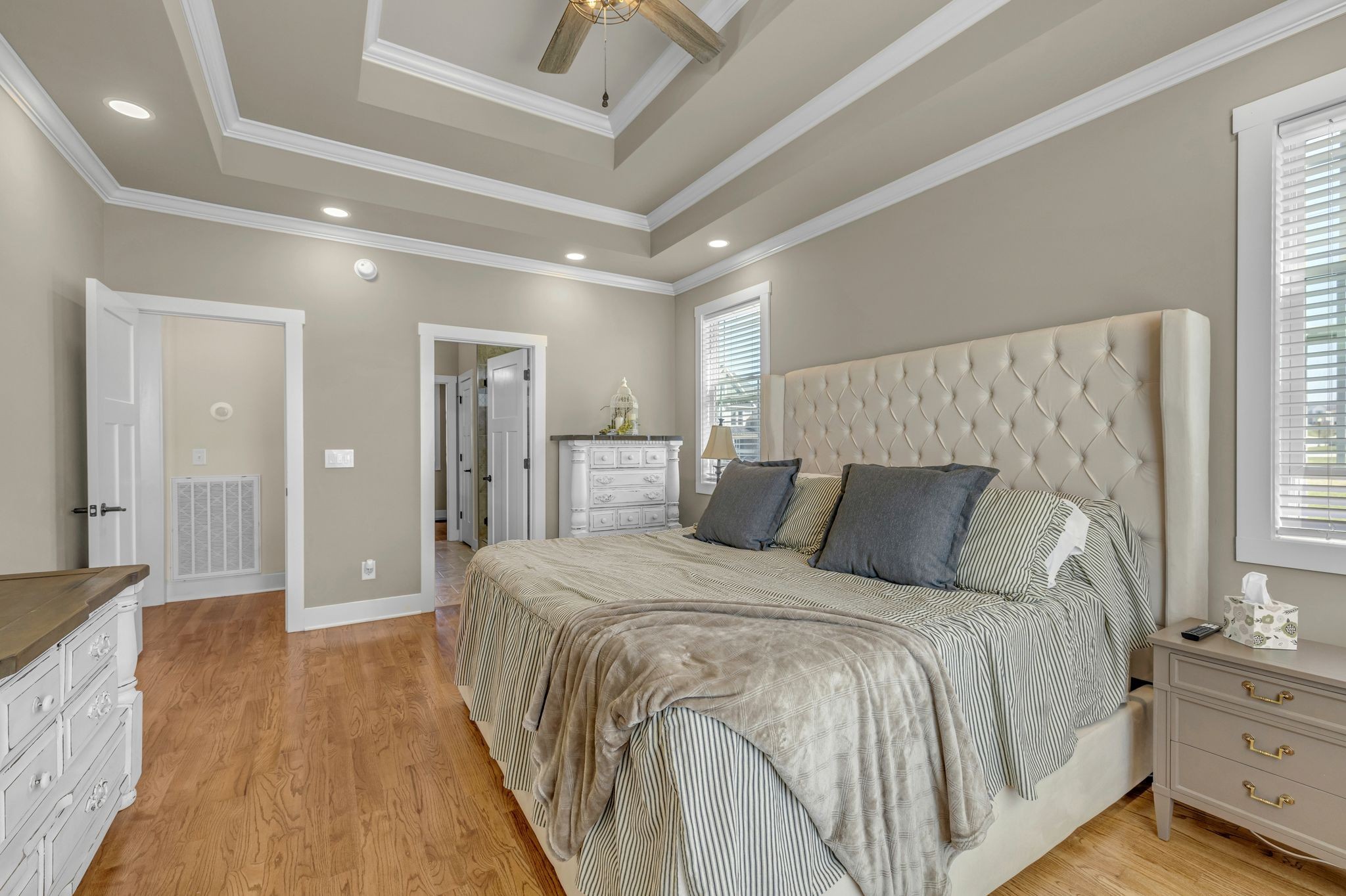 214 River Watch Way Winchester, TN 37398 - Photo 22 of 82 a spacious bedroom with a bed and a chandelier