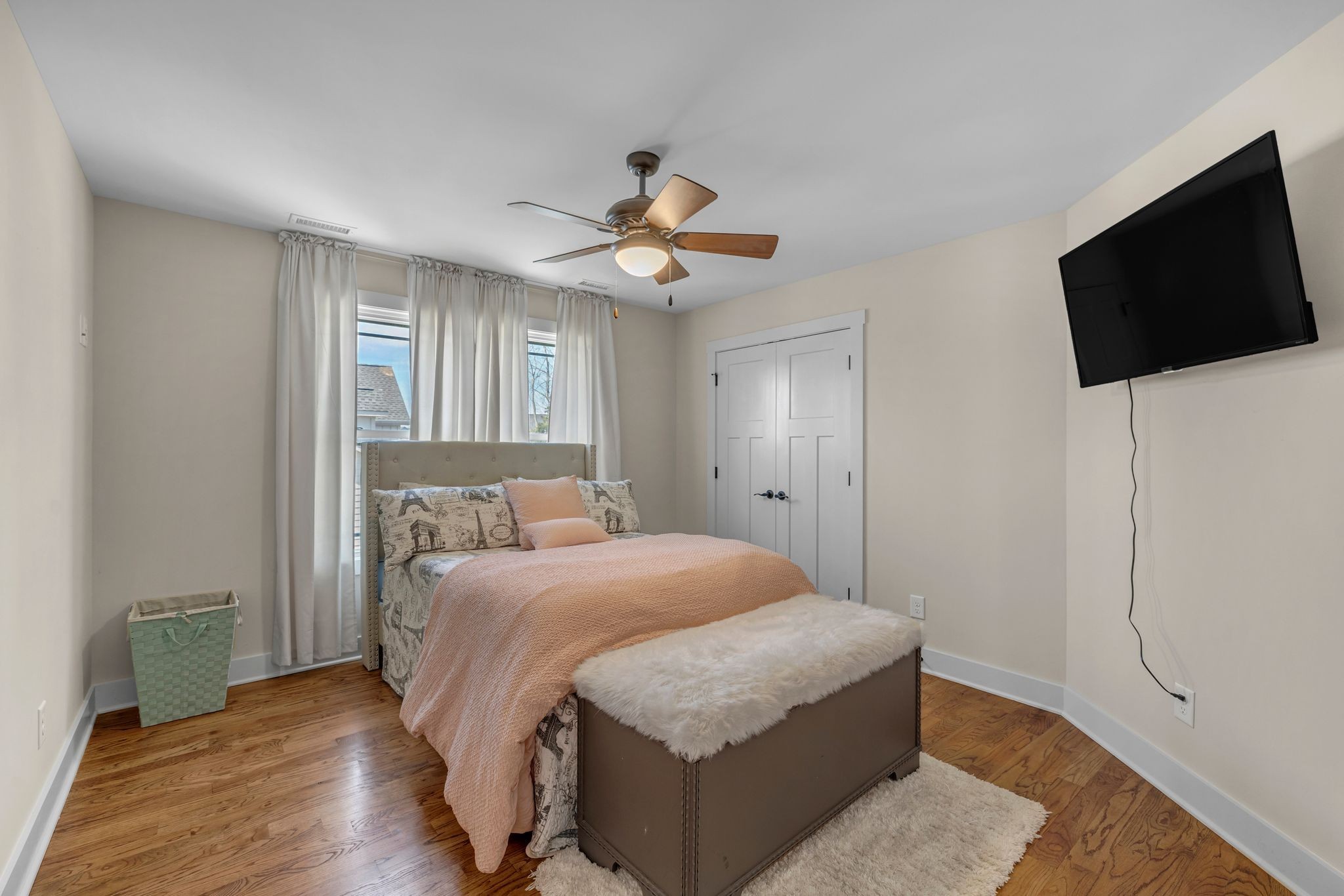 214 River Watch Way Winchester, TN 37398 - Photo 31 of 82 a bedroom with a bed a flat screen tv and a chandelier