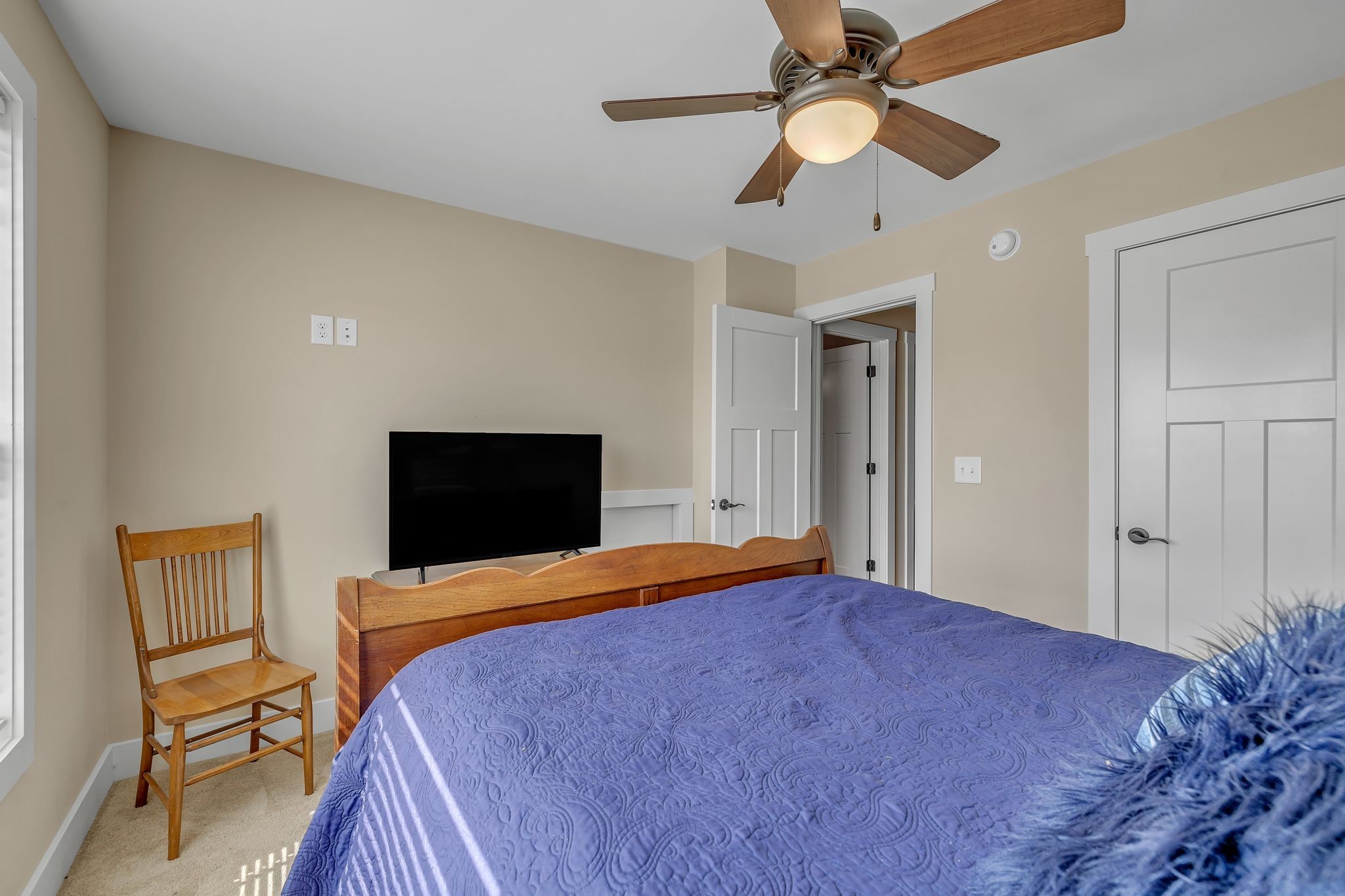 214 River Watch Way Winchester, TN 37398 - Photo 35 of 82 a bedroom with a bed and a chandelier