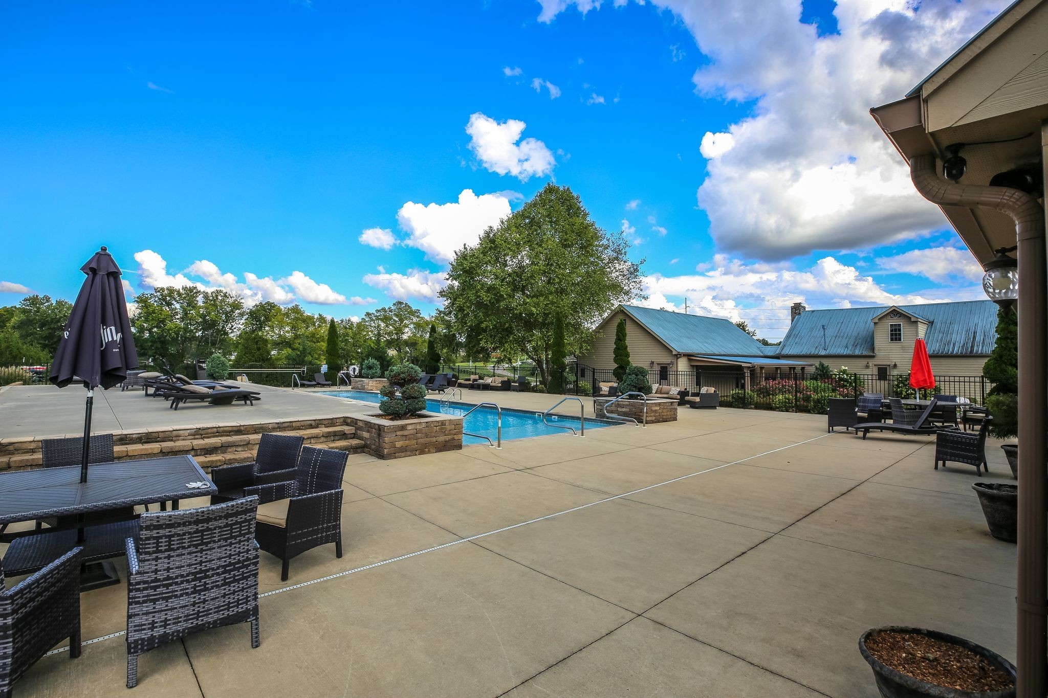 214 River Watch Way Winchester, TN 37398 - Photo 46 of 82 a view of a patio with couches and table and chairs and potted plants