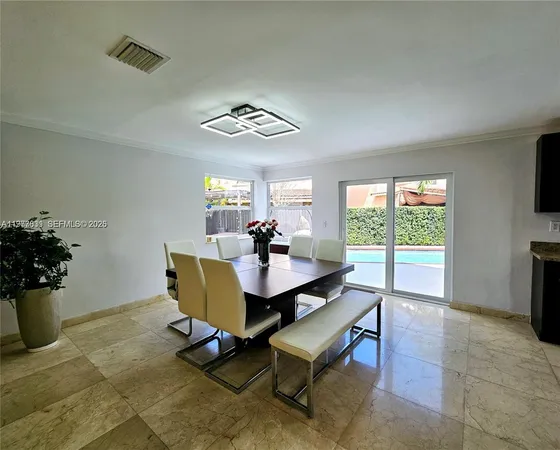 a kitchen with stainless steel appliances granite countertop a stove a refrigerator and a refrigerator