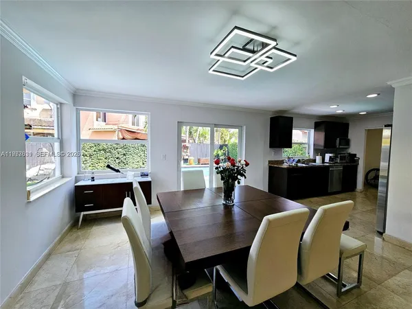 a view of green field with house in the background