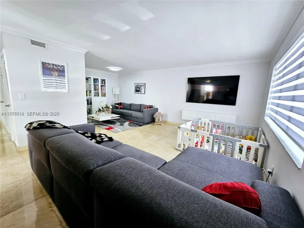 a living room with furniture and a couch