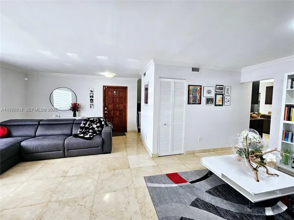 a view of a hallway with a wooden cabinets