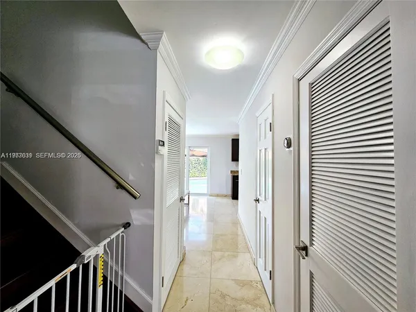 a view of a livingroom with furniture and a potted plant