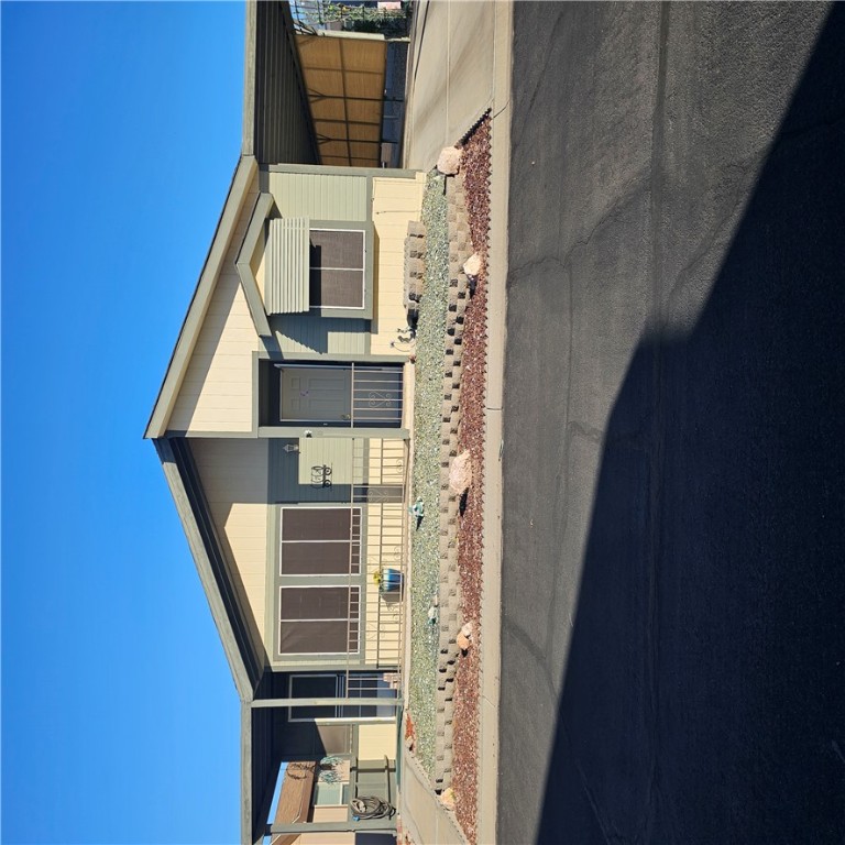 1545 East El Rodeo Road, Unit 72 Fort Mohave, AZ 86426 - Photo 1 of 3 Manufactured / mobile home with an attached carport and concrete driveway