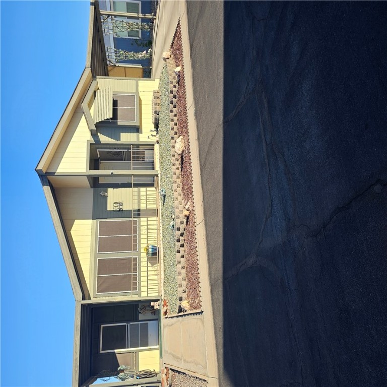 1545 East El Rodeo Road, Unit 72 Fort Mohave, AZ 86426 - Photo 2 of 3 Manufactured / mobile home with an attached carport and concrete driveway