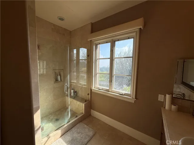a bathroom with a tub shower and sink