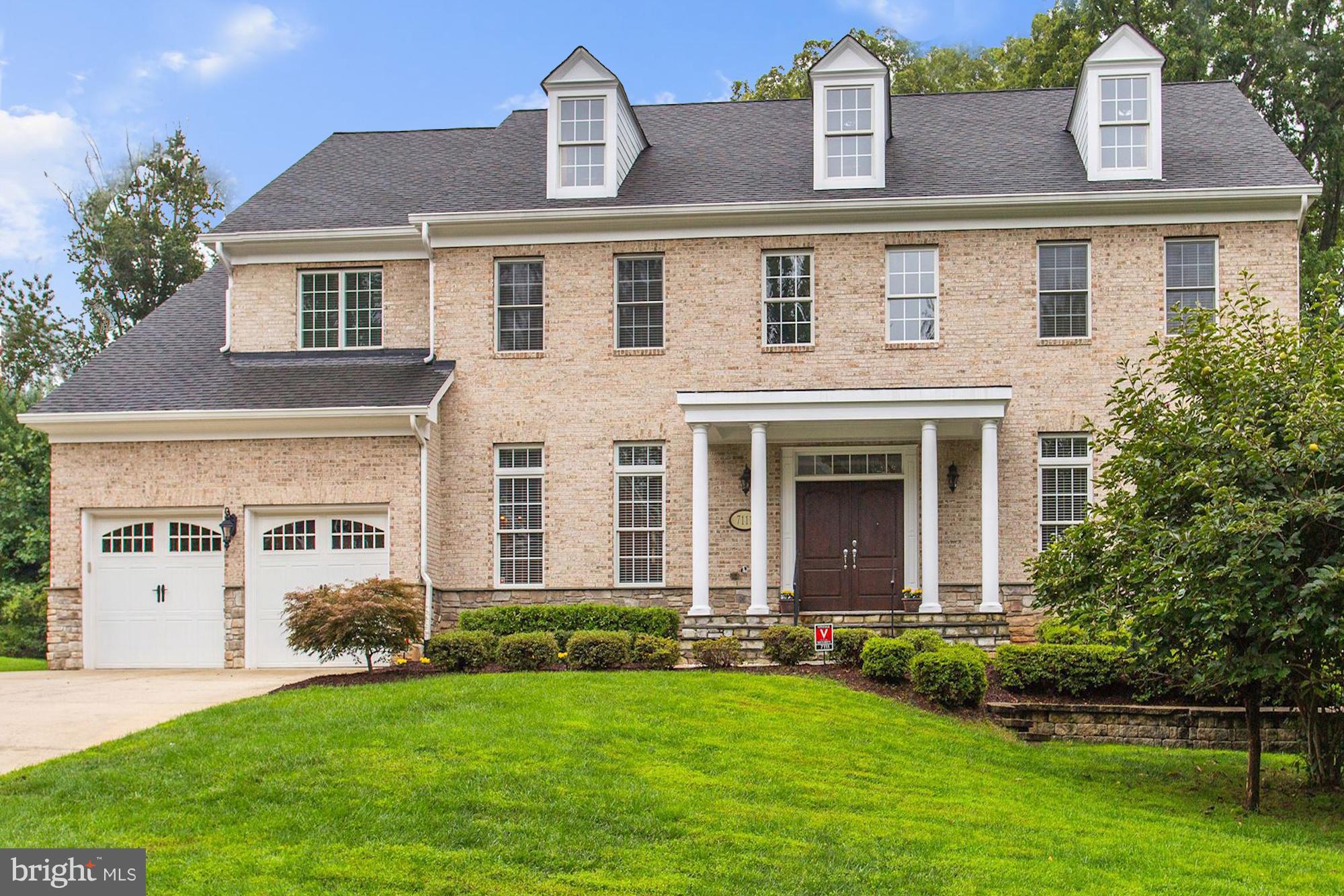 7111 Granberry Way Springfield, VA 22151 - Photo 2 of 30 front view of a house with a yard