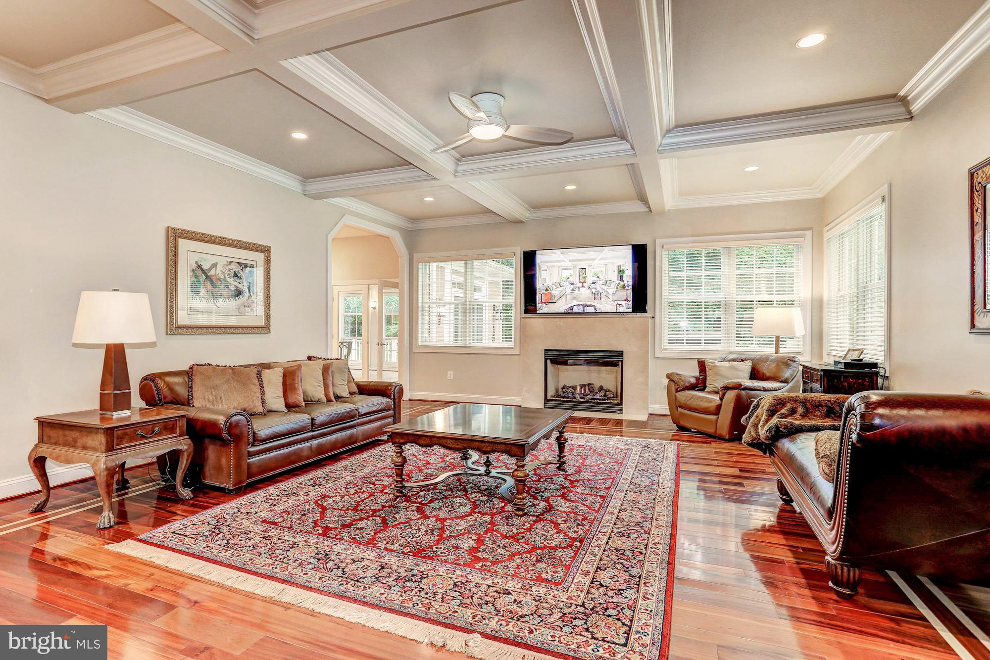 7111 Granberry Way Springfield, VA 22151 - Photo 11 of 30 a living room with furniture fireplace and a table