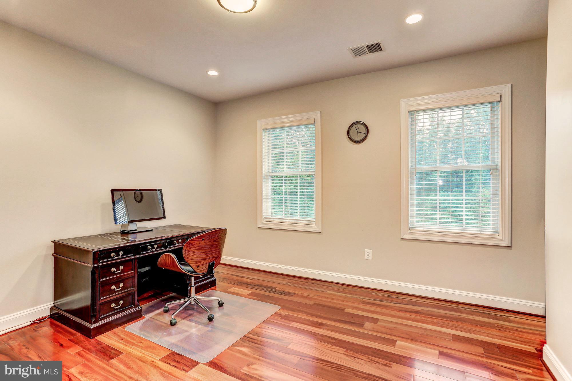7111 Granberry Way Springfield, VA 22151 - Photo 22 of 30 a view of a workspace with furniture and a window