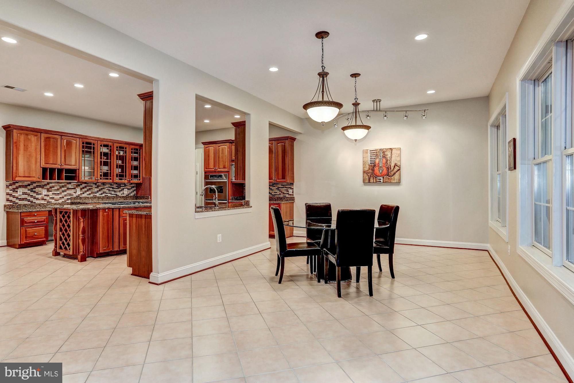 7111 Granberry Way Springfield, VA 22151 - Photo 8 of 30 a view of a dining room with furniture