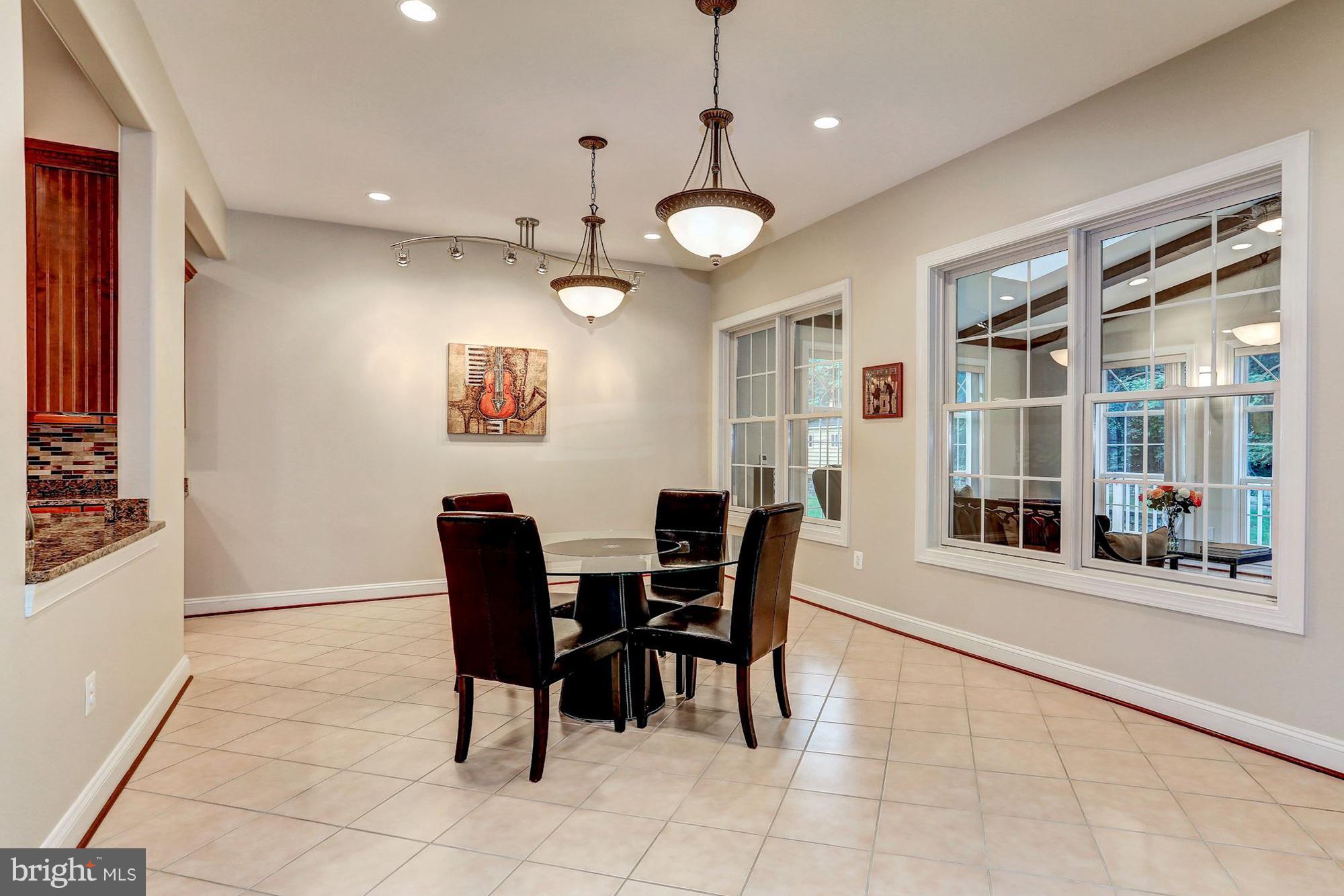 7111 Granberry Way Springfield, VA 22151 - Photo 9 of 30 a view of a dining room with furniture and chandelier