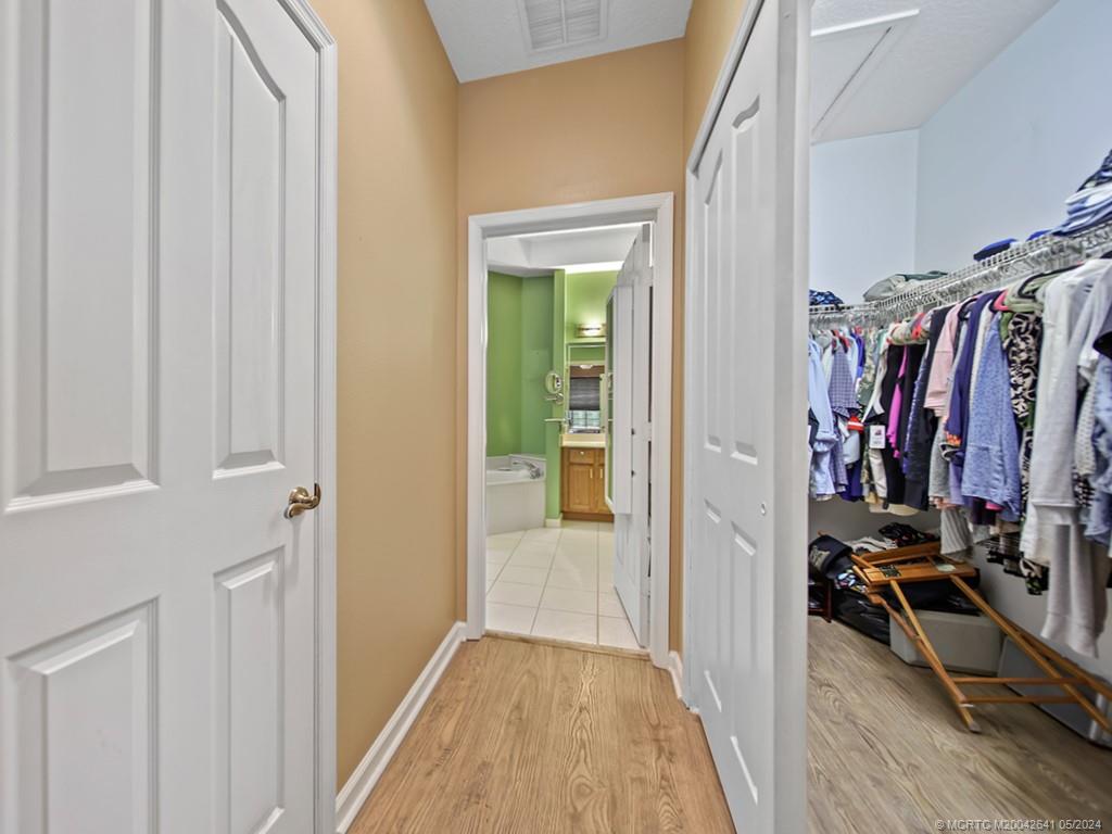 570 Northwest Red Pine Way Jensen Beach, FL 34957 - Photo 12 of 19 a view of a walk in closet