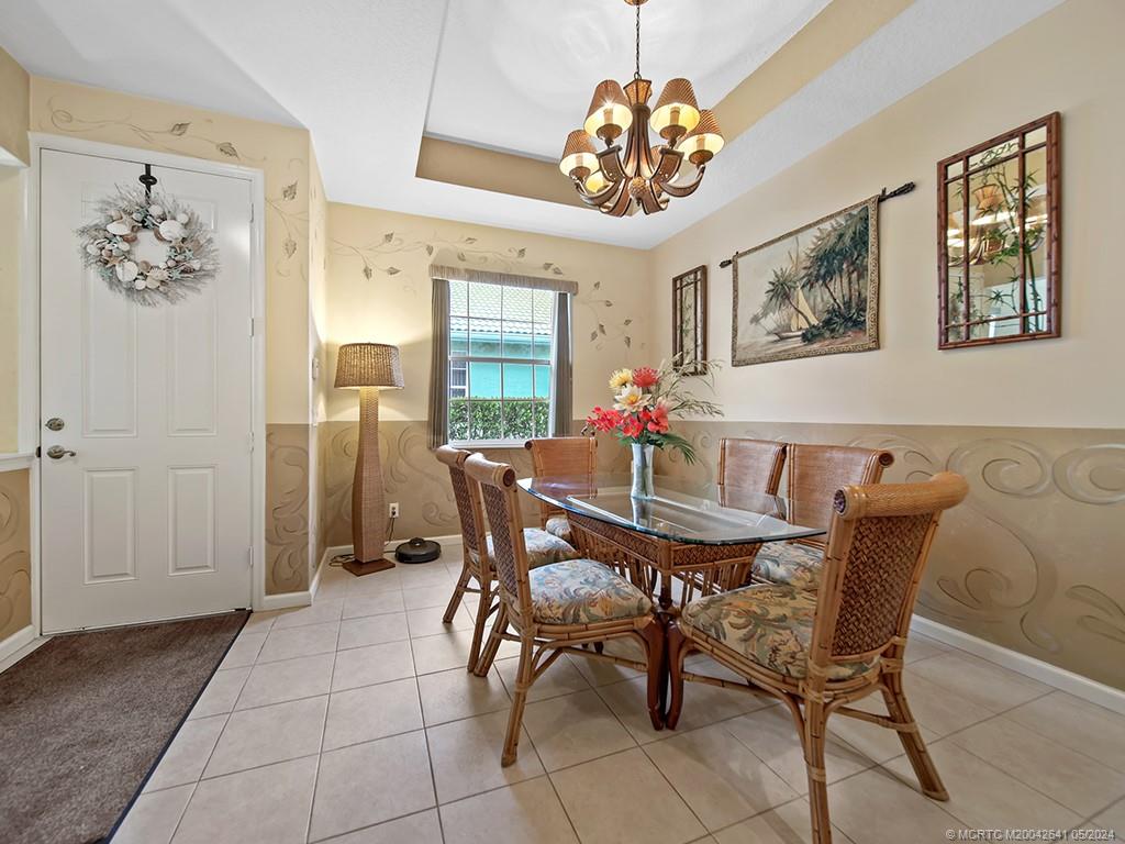 570 Northwest Red Pine Way Jensen Beach, FL 34957 - Photo 5 of 19 a view of a dining room with furniture