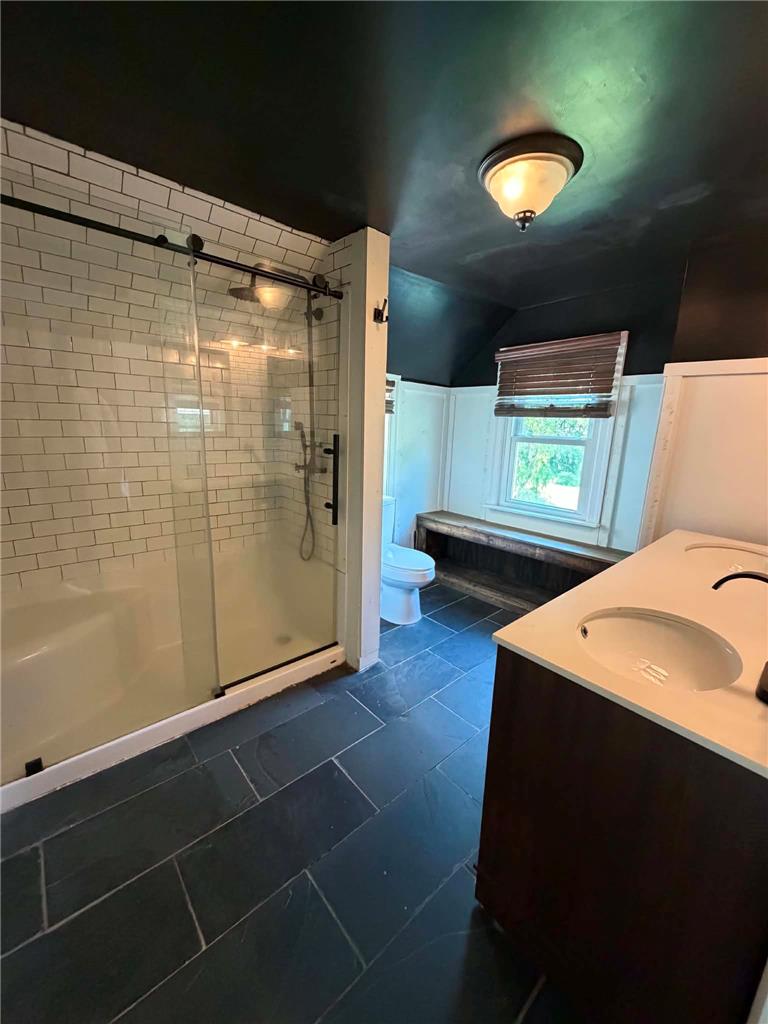 164 Sand Spring Road Cresco, PA 18326 - Photo 49 of 60 Modern bathroom featuring sleek vanity, tiled flooring, and a contemporary shower.