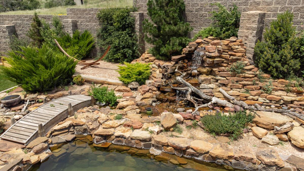21401 Hope Road Canyon, TX 79015 - Photo 17 of 112 21401_Hope_Rd_074_Backyard_Waterfall