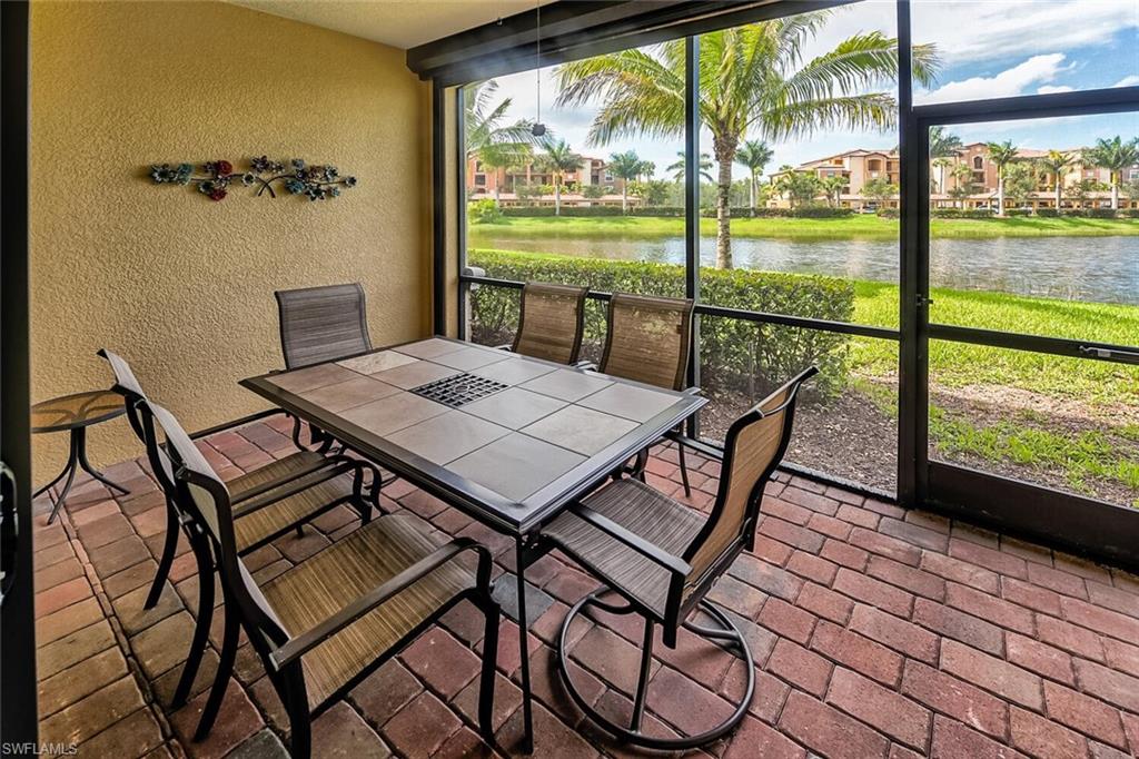 9528 Avellino Way, Unit 2515 Naples, FL 34113 - Photo 21 of 35 a view of a city from a dining room with furniture and window