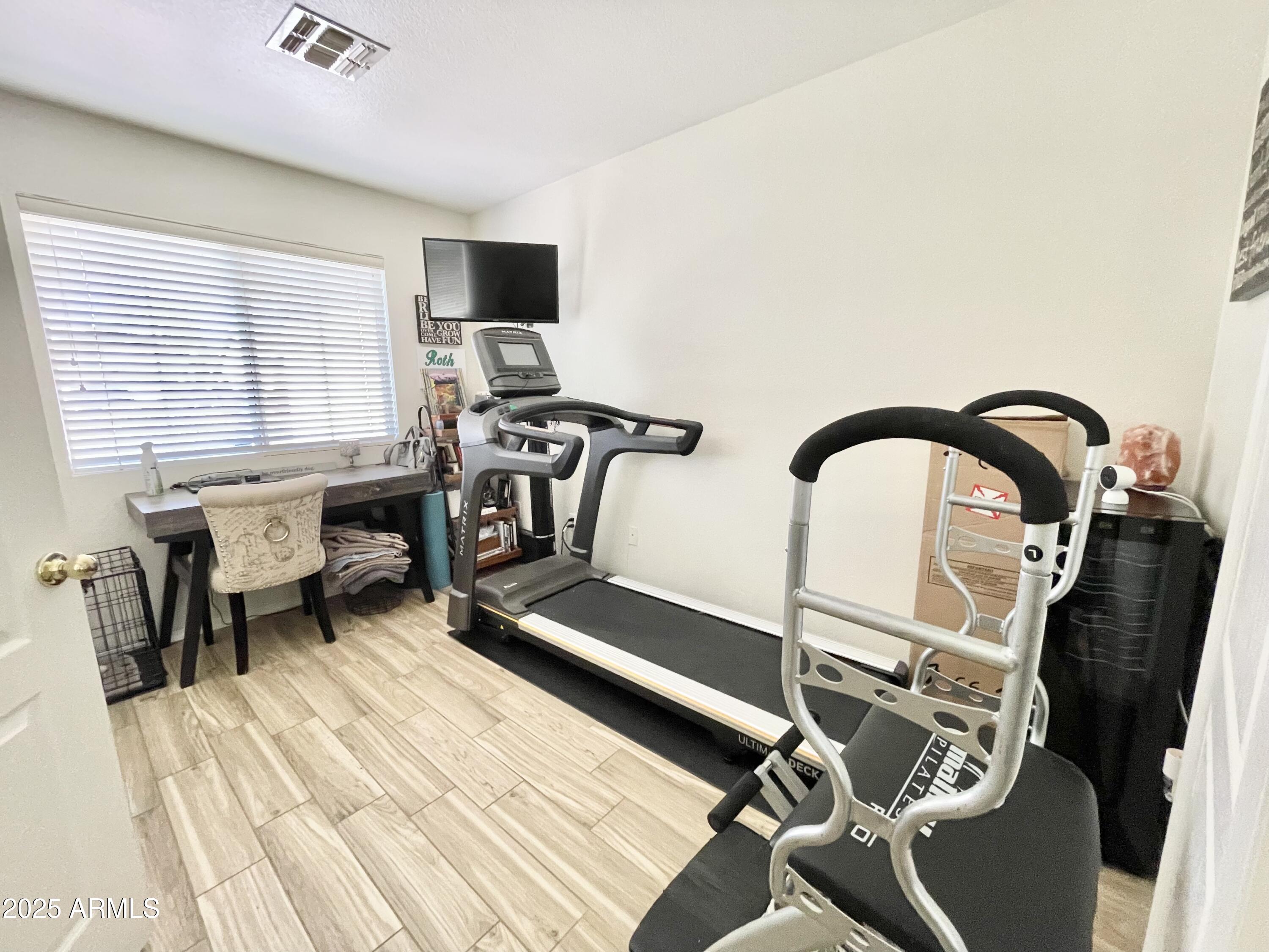2735 East Harwell Road Gilbert, AZ 85234 - Photo 24 of 43 a workspace with a table chairs and a window