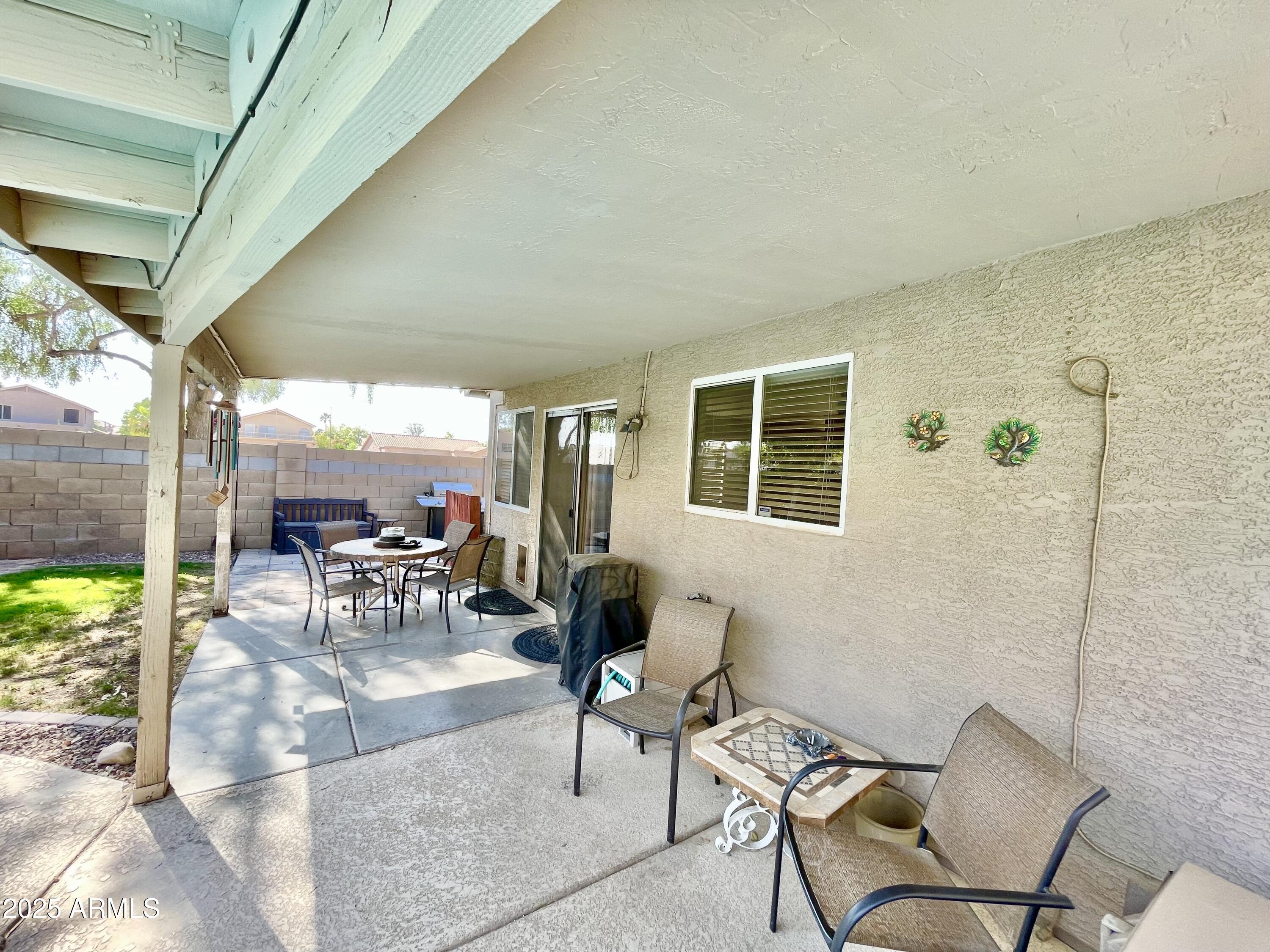 2735 East Harwell Road Gilbert, AZ 85234 - Photo 33 of 43 a living room with patio furniture and a potted plant