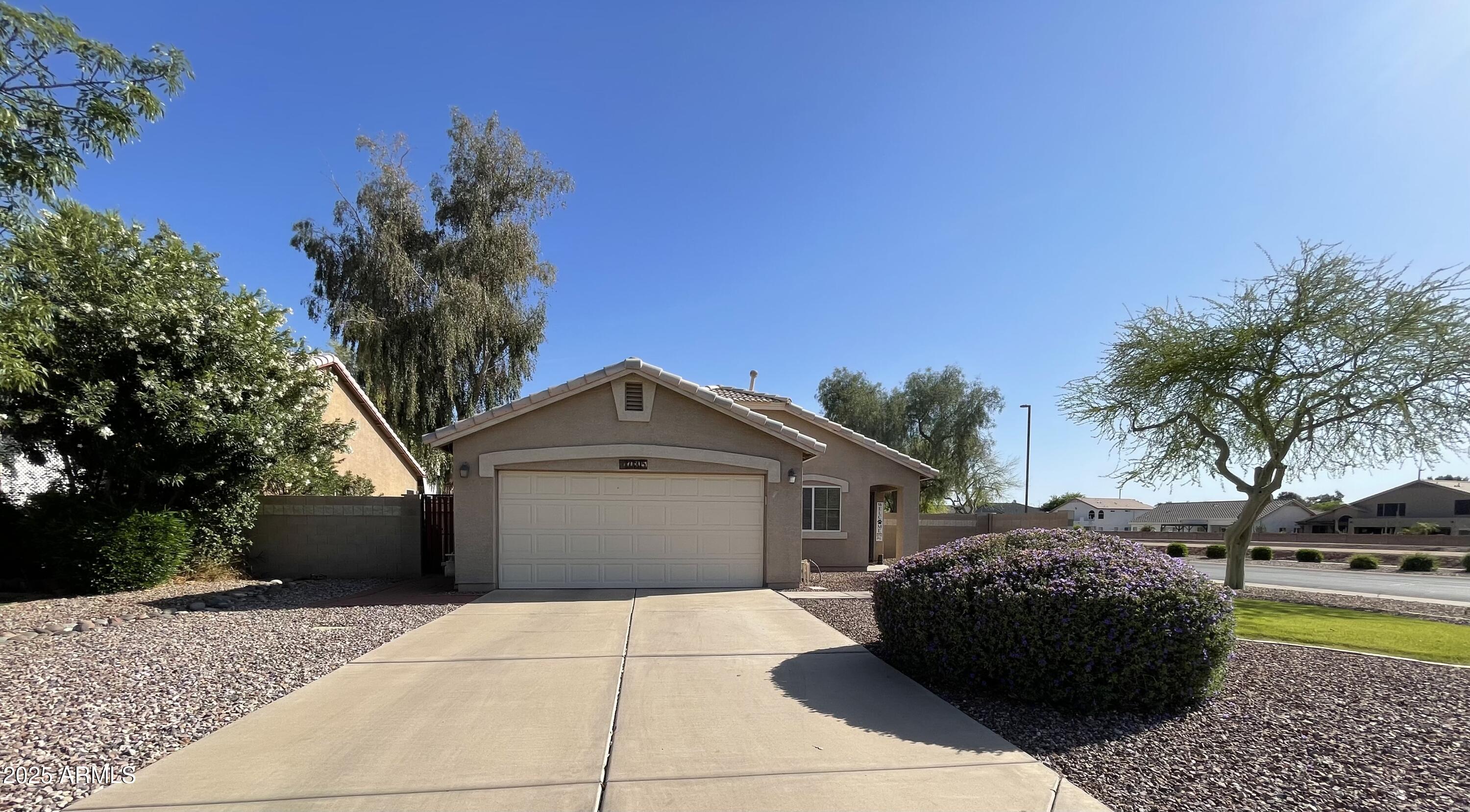 2735 East Harwell Road Gilbert, AZ 85234 - Photo 36 of 43 a front view of a house with a garden