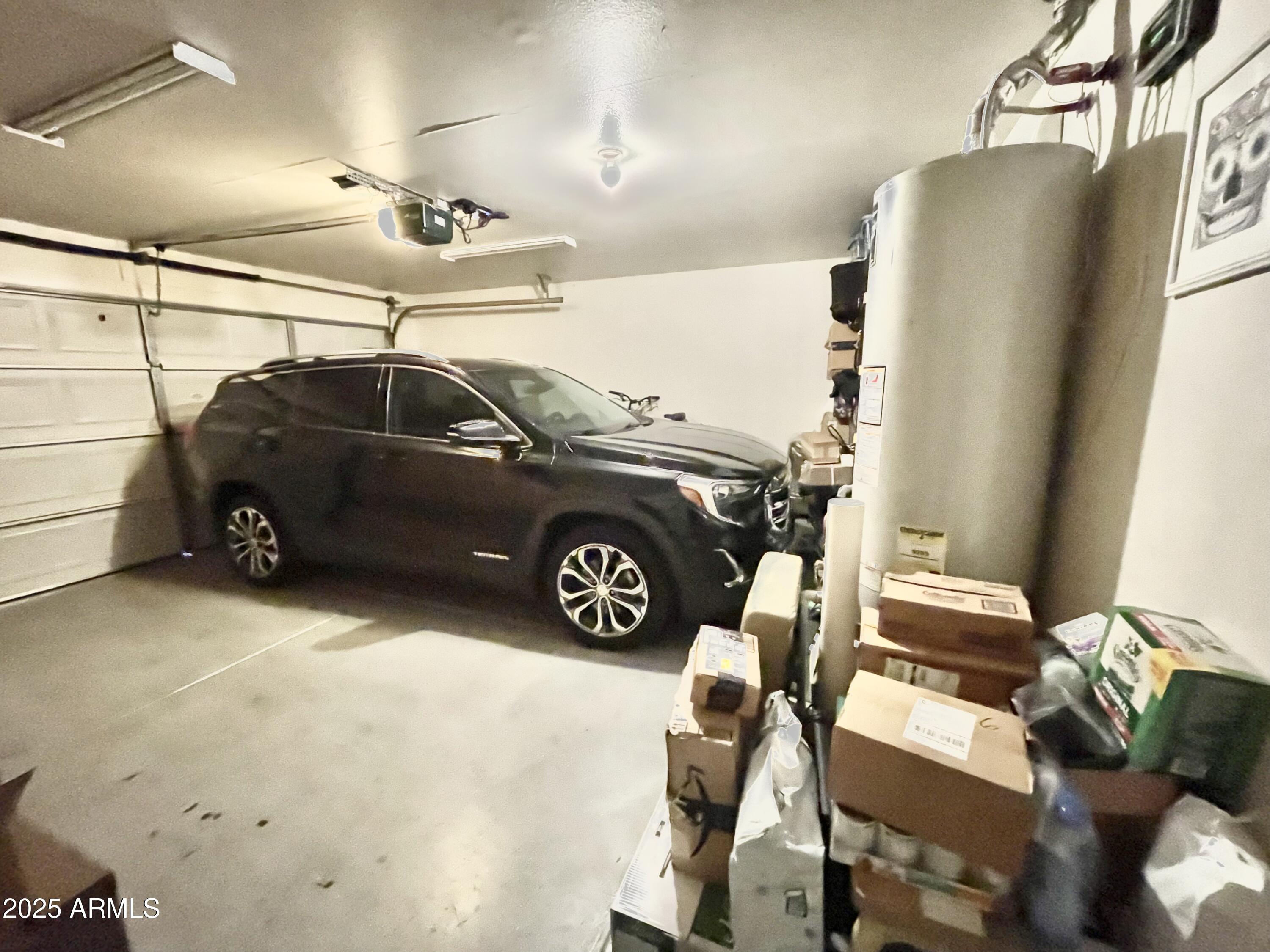 2735 East Harwell Road Gilbert, AZ 85234 - Photo 38 of 43 a car parked in a garage