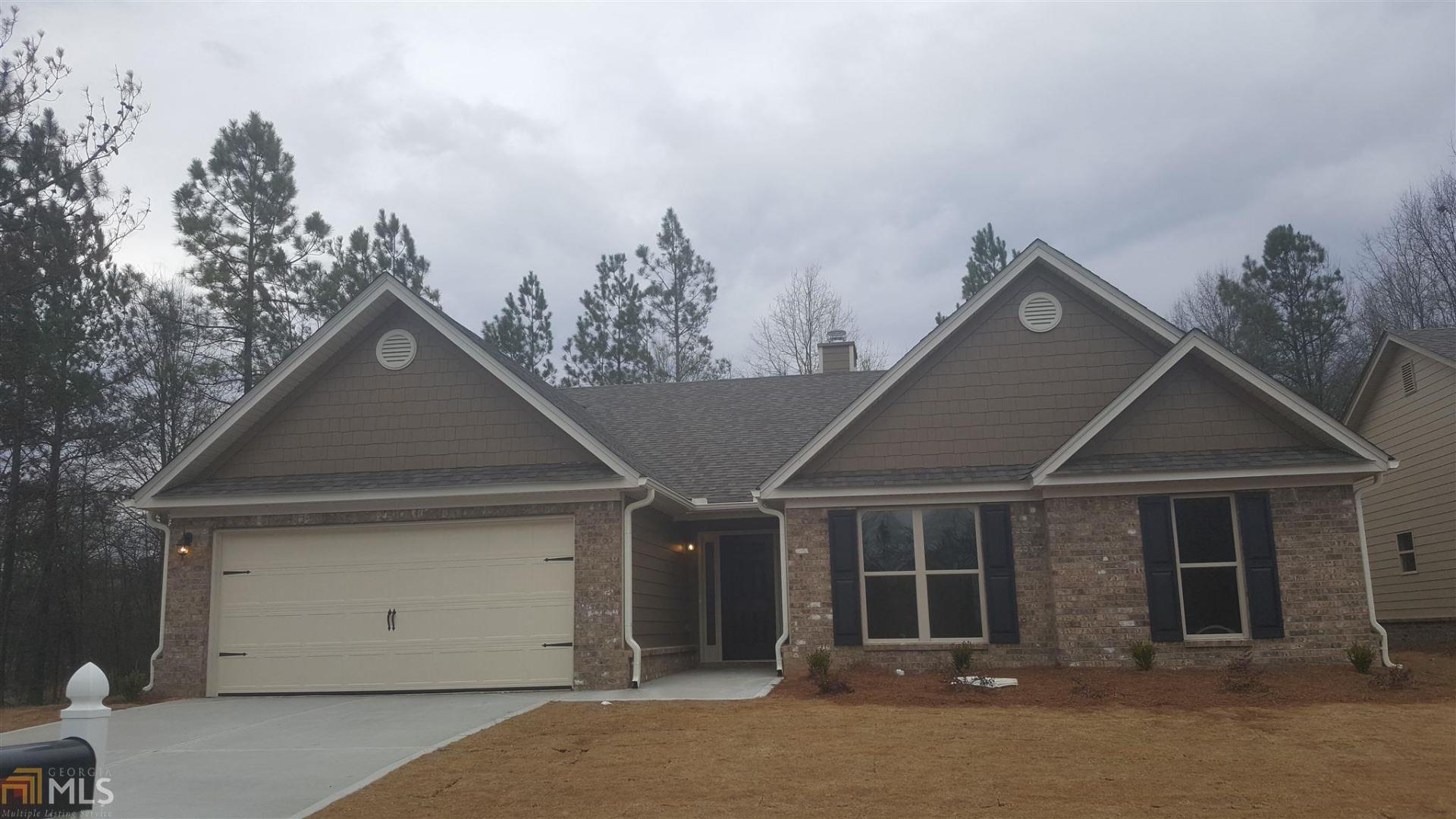 1012 Clacktown Road, Unit 5 Winder, GA 30680 - Photo 1 of 1 a front view of a house with a yard and garage