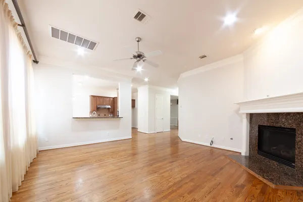 a view of a kitchen with a sink and a fireplace