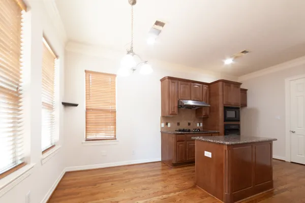 a kitchen with stainless steel appliances a refrigerator and a sink