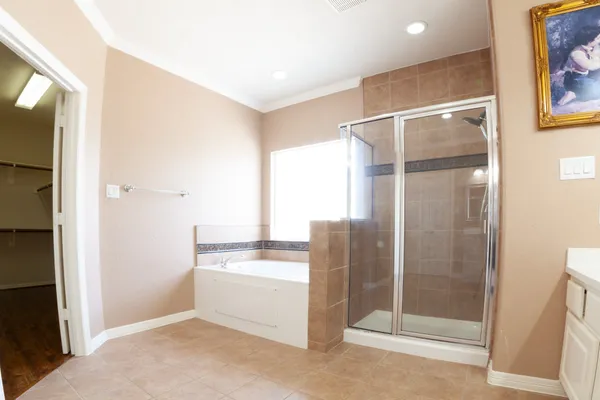 a bathroom with a shower and a sink