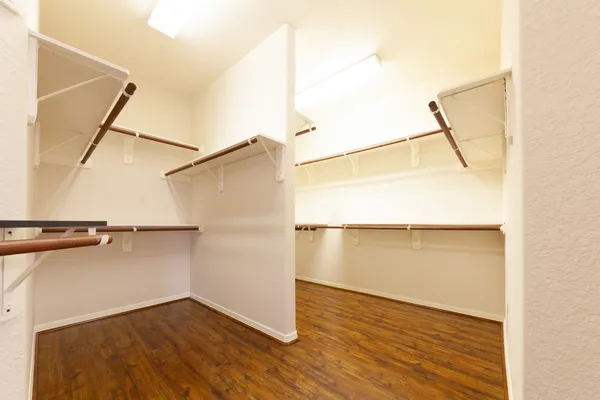a view of an empty walk in closet